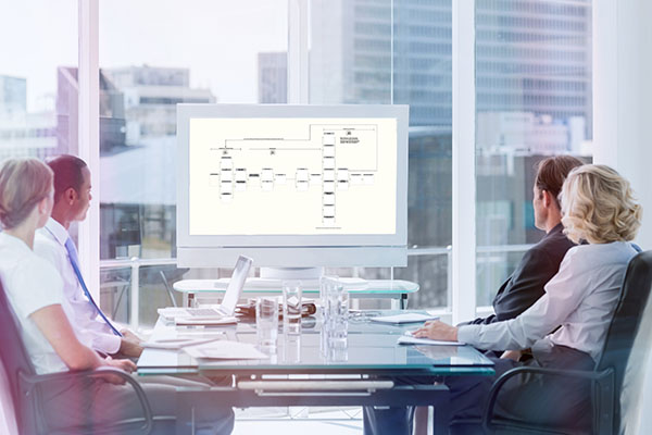 webinar edited Webinar Framework presented to executives at a table in conference room